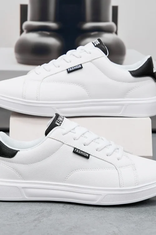 أحذية رجالية مريحة كاجوال للنساء أحذية رياضية من الجلد الأبيض خفيفة الوزن للمشي في الهواء الطلق ورياضة الجري والتنس zapatillas